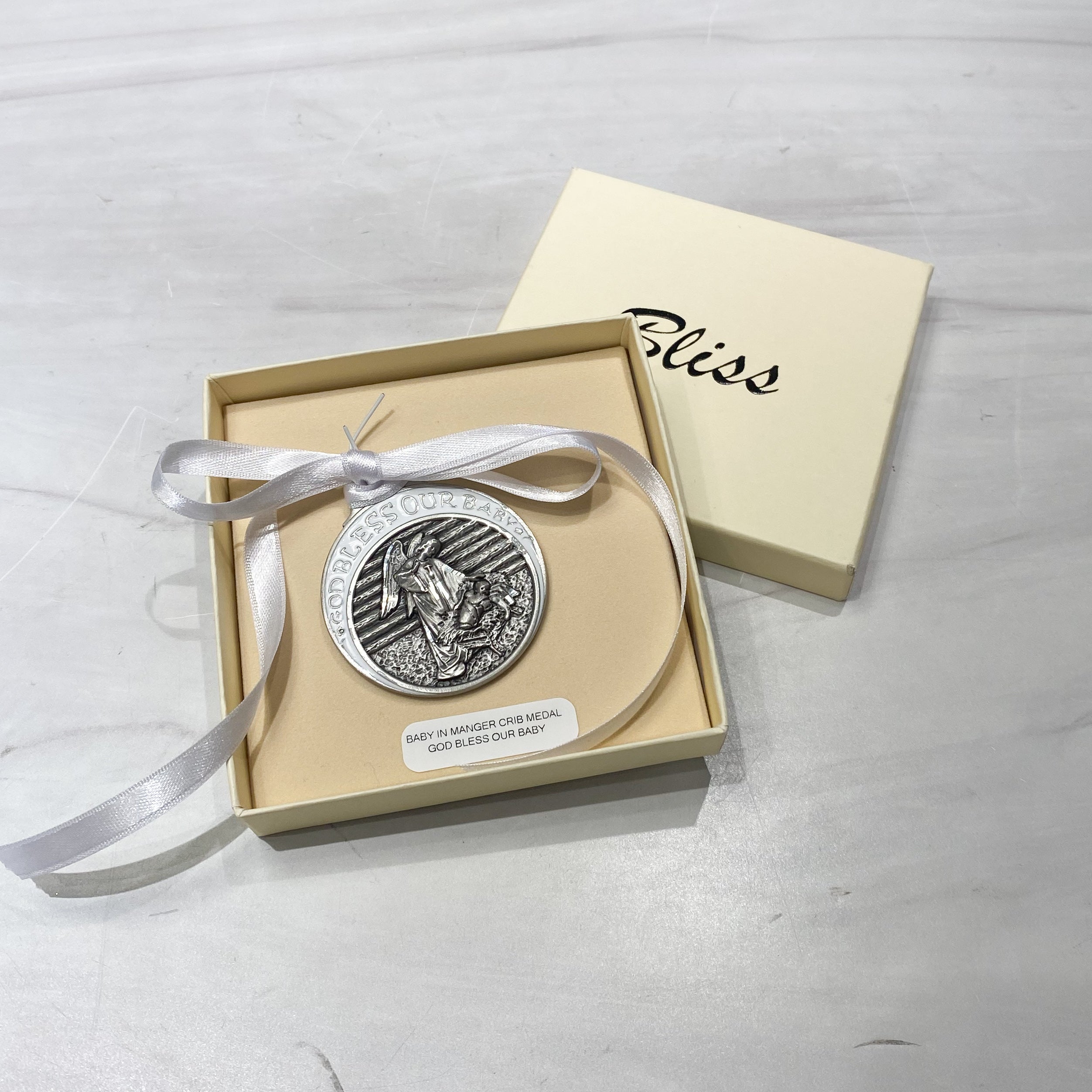 White Pewter Baby in Manger Crib Medal