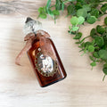 HWB24083 - Holy Water Bottle - St. Joseph with the Child Jesus, Large Antique Amber