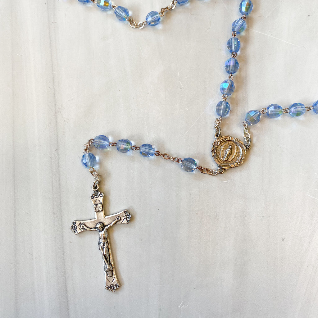 7mm Sapphire Crystal Aurora Borealis Rosary with Deluxe Crucifix and Center in a Grey Velvet Box