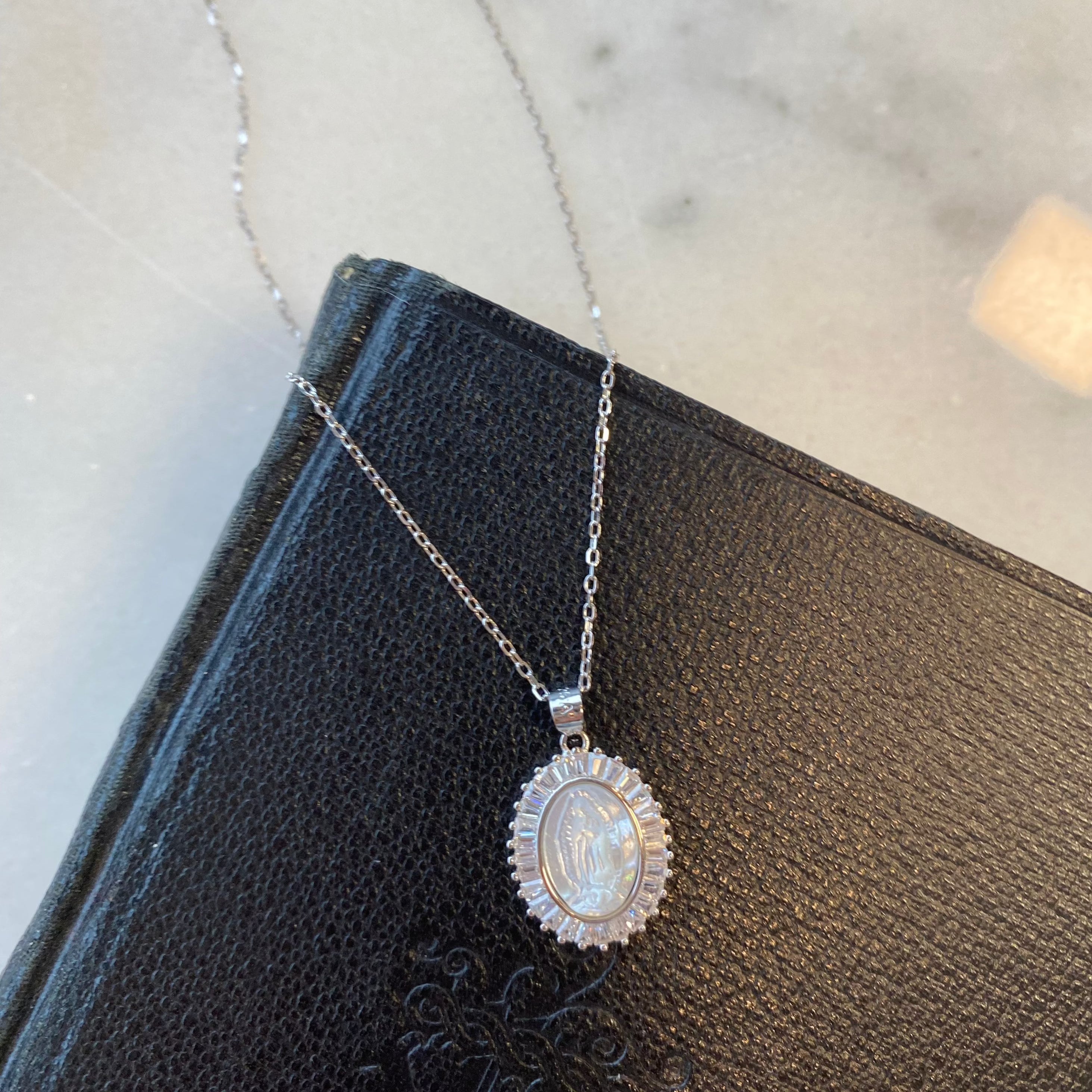 Sterling SIlver Mother of Pearl Our Lady of Guadalupe Necklace with CZ Border